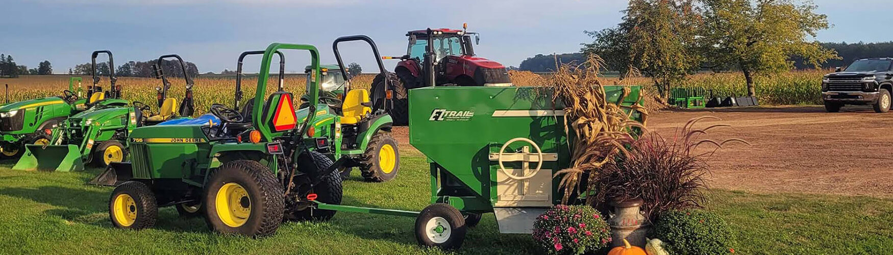 small green tractors in a yard